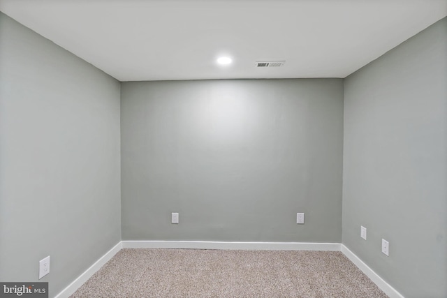 empty room featuring light colored carpet