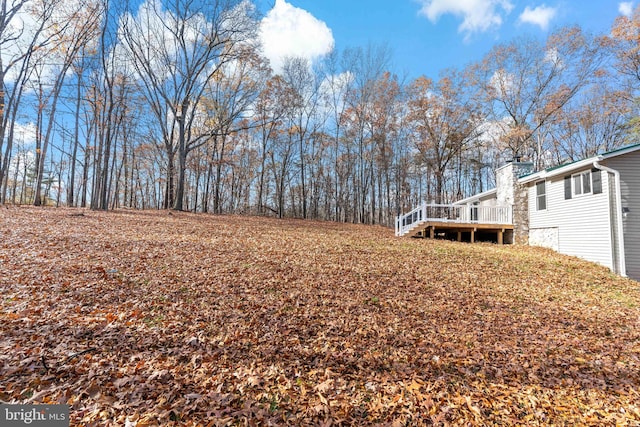 view of yard featuring a wooden deck