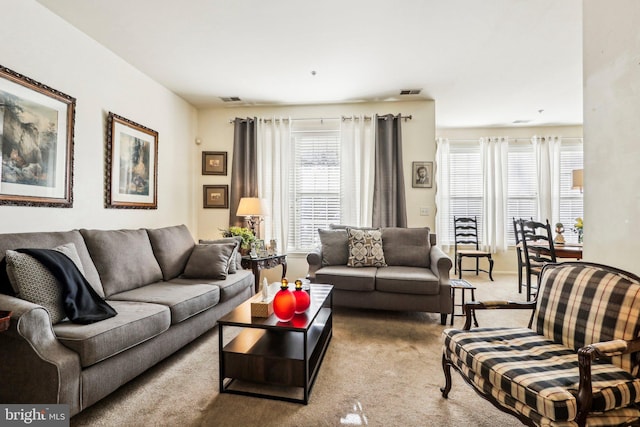 living room featuring carpet flooring and a wealth of natural light