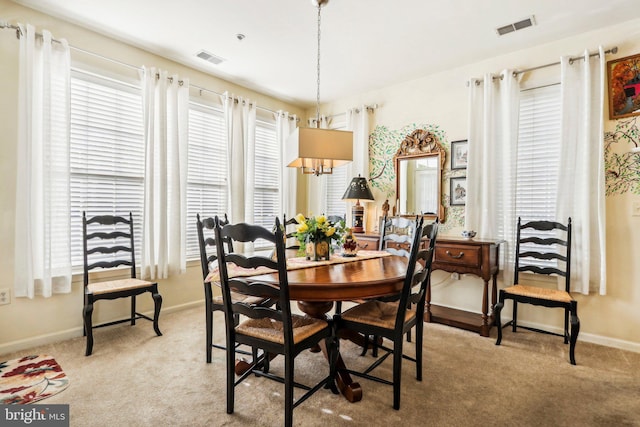 view of carpeted dining area