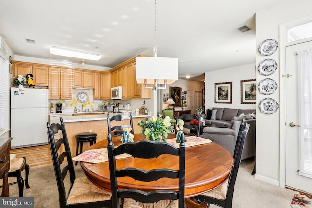 view of carpeted dining space