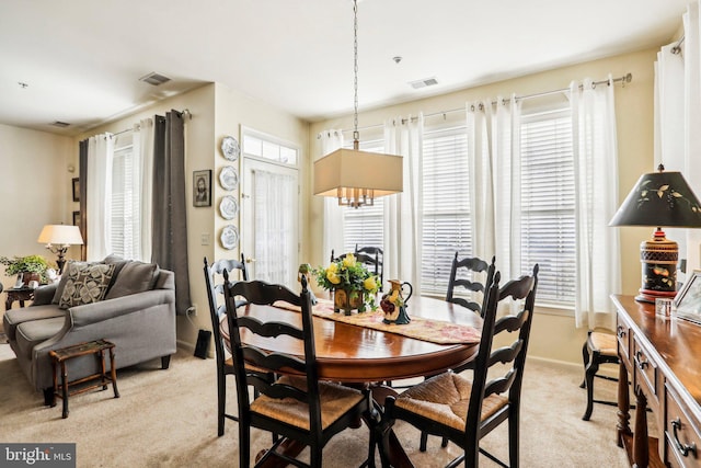 view of carpeted dining space