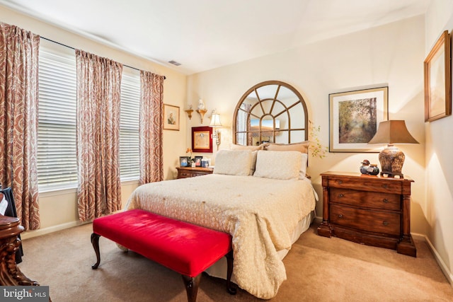 bedroom with light colored carpet