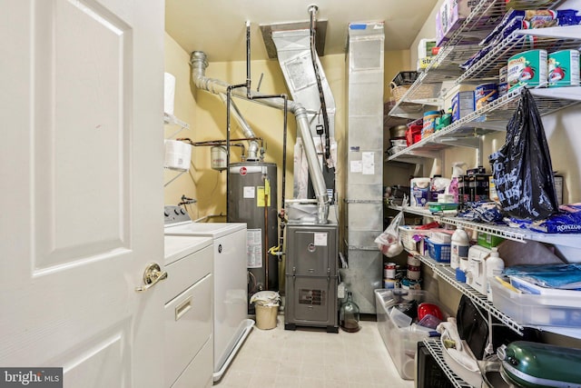 utility room featuring independent washer and dryer and gas water heater