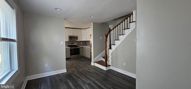 interior space featuring a healthy amount of sunlight and dark wood-type flooring