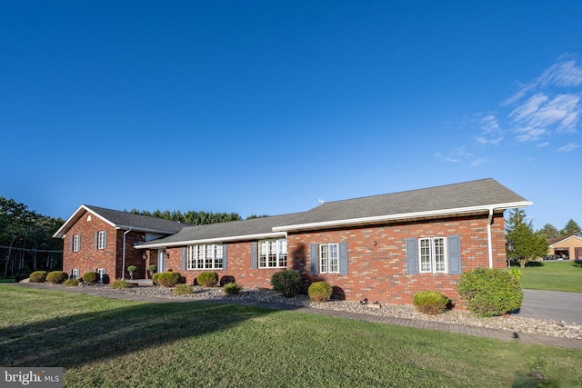 ranch-style house with a front yard