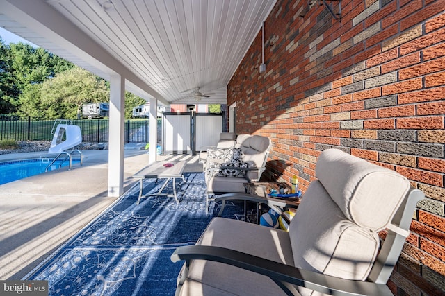 view of patio with a fenced in pool