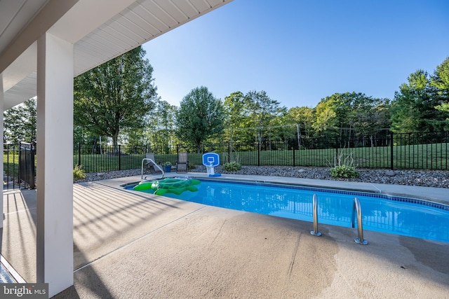 view of pool featuring a patio area