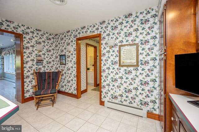 bathroom featuring a baseboard radiator, a textured ceiling, and tile patterned floors