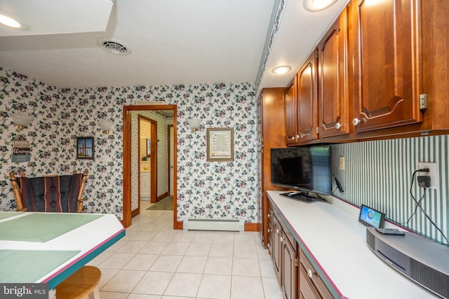 kitchen with a baseboard radiator and light tile patterned floors