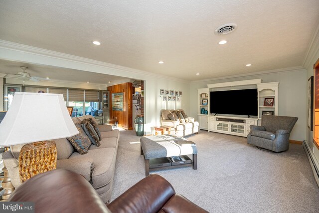 carpeted living room with ornamental molding, a textured ceiling, and ceiling fan