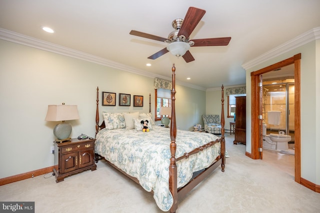 carpeted bedroom featuring ensuite bathroom, ceiling fan, and crown molding