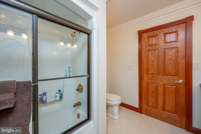 bathroom featuring toilet, bath / shower combo with glass door, tile patterned flooring, and crown molding