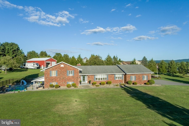 ranch-style house with a front lawn