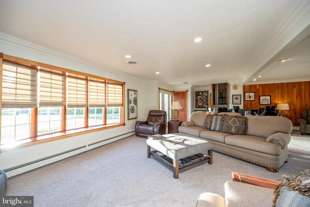 living room featuring light colored carpet, a baseboard radiator, wood walls, a textured ceiling, and crown molding