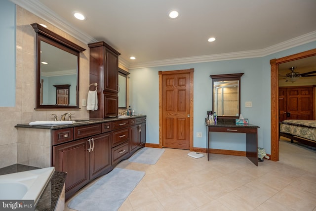 bathroom with a bath, ceiling fan, vanity, and crown molding