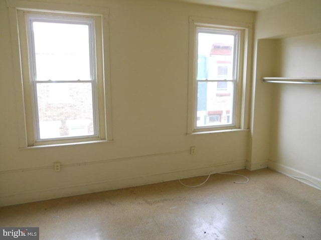 unfurnished room with plenty of natural light