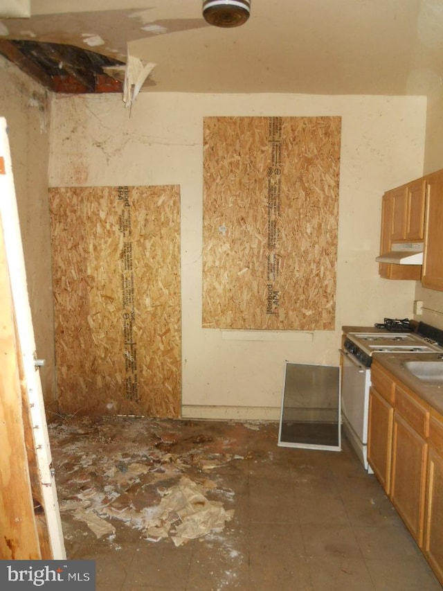 kitchen with white range with gas stovetop