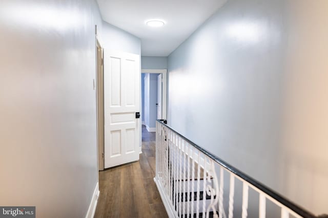 corridor with dark wood-type flooring