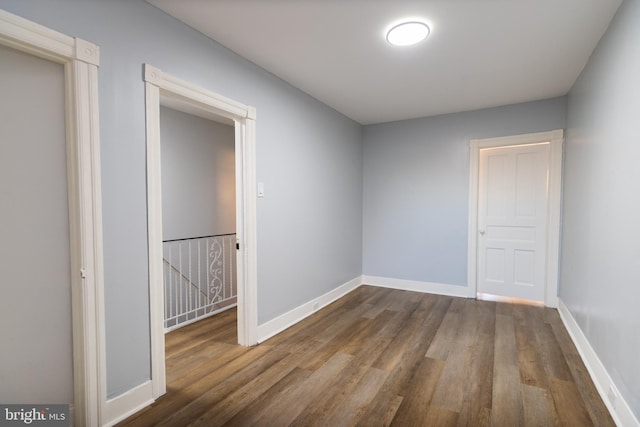 spare room featuring dark hardwood / wood-style floors