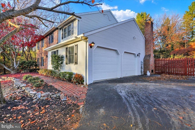 view of side of property featuring a garage