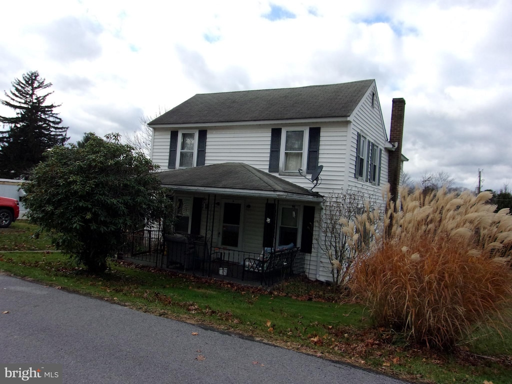 view of property featuring a porch