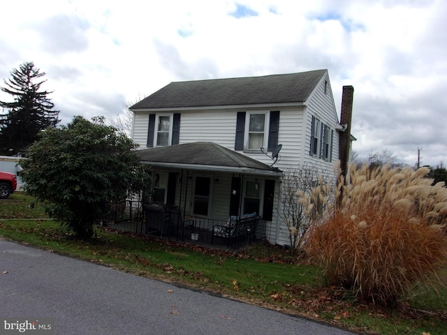 view of property featuring a porch