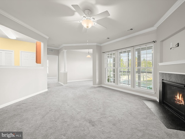 unfurnished living room with carpet flooring, ceiling fan, and ornamental molding