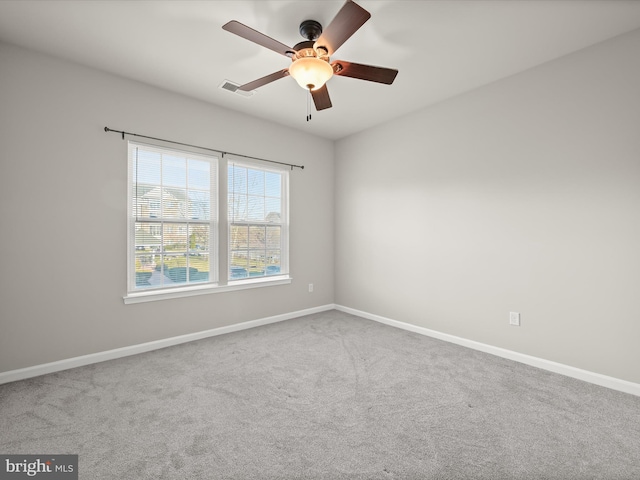 spare room with ceiling fan and carpet floors