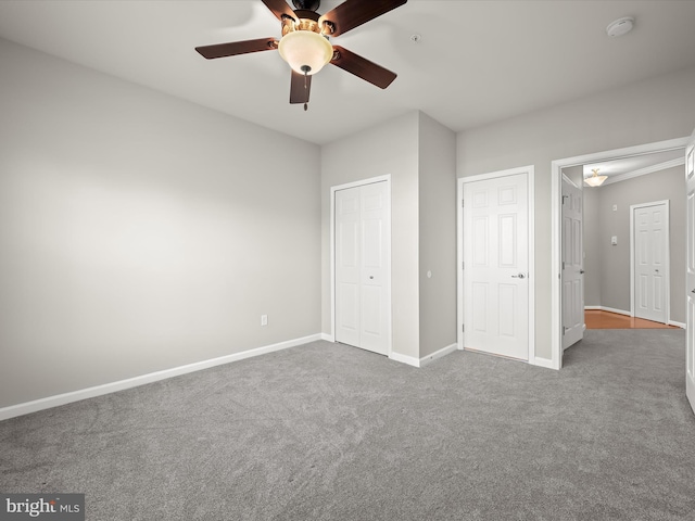 unfurnished bedroom featuring carpet flooring and ceiling fan