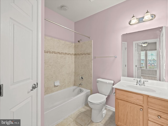 full bathroom with tile patterned flooring, vanity, toilet, and tiled shower / bath