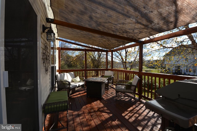 deck with outdoor lounge area and area for grilling