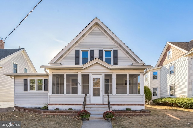 view of front of property with a sunroom