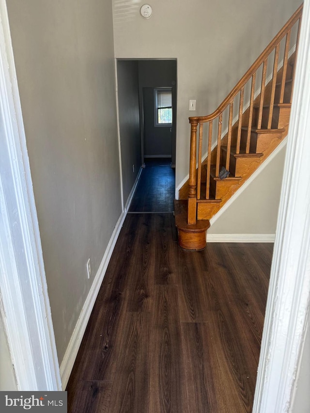 hall with dark hardwood / wood-style floors