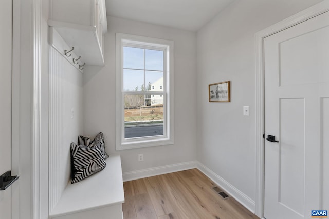 mudroom with light hardwood / wood-style flooring