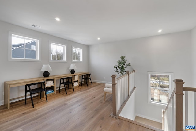 office with light hardwood / wood-style floors