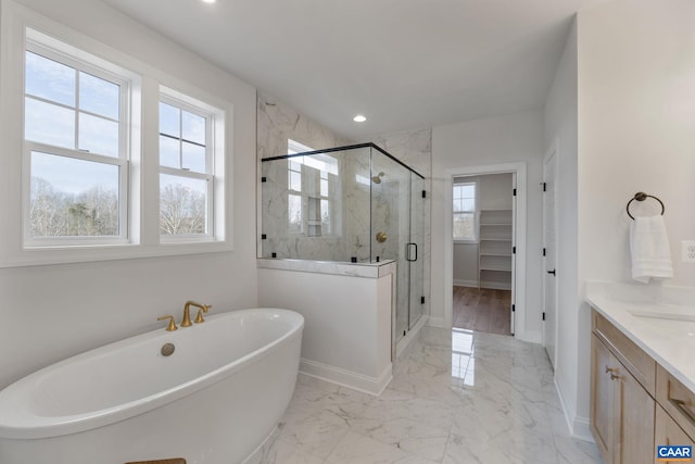 bathroom featuring vanity and plus walk in shower