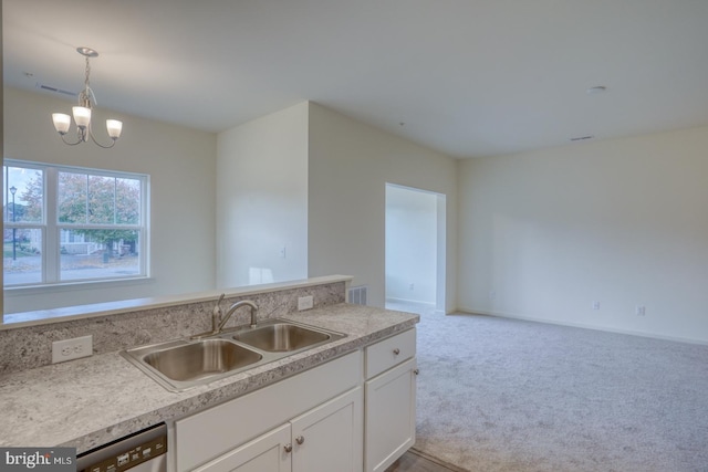 kitchen with white cabinetry, sink, light colored carpet, pendant lighting, and dishwasher