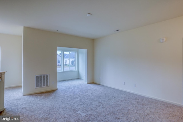 empty room featuring light colored carpet