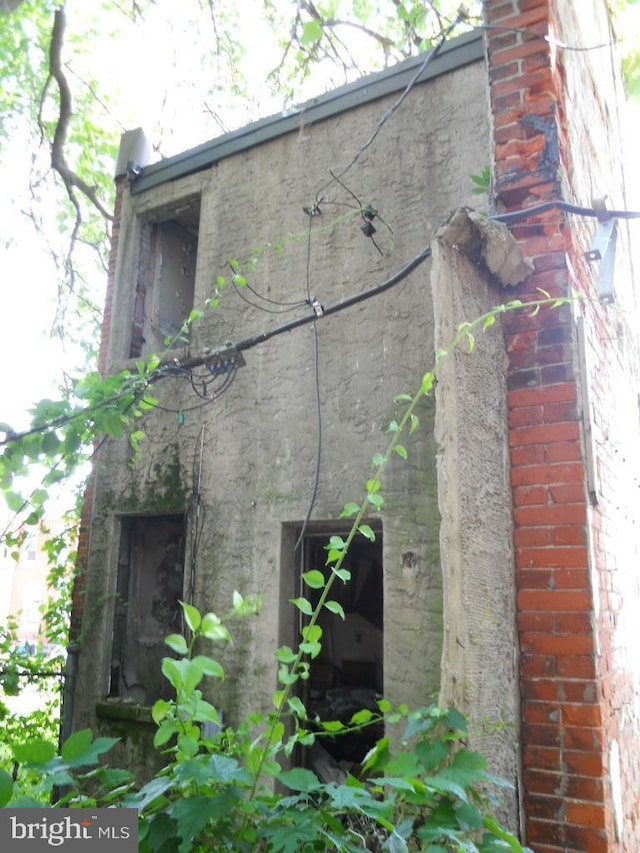 2440 N Corlies St, Philadelphia, PA 19132 - view of home's exterior featuring a chimney