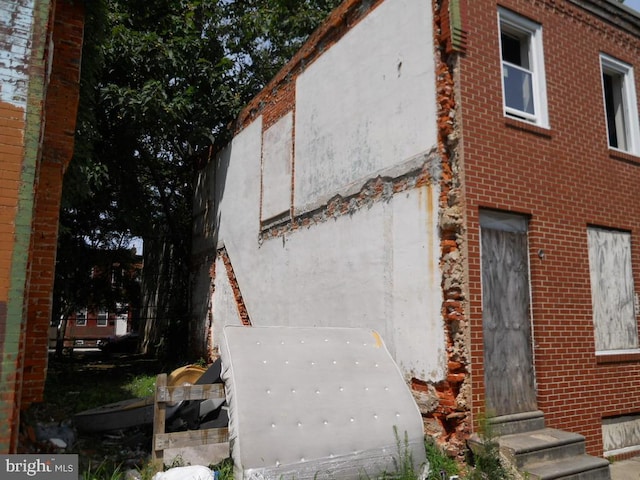 2440 N Corlies St, Philadelphia, PA 19132 - view of property exterior featuring stucco siding and brick siding