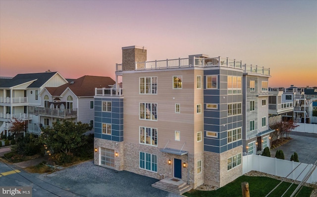 view of outdoor building at dusk