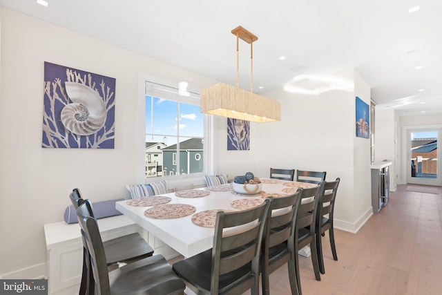 dining space featuring a healthy amount of sunlight and light wood-type flooring