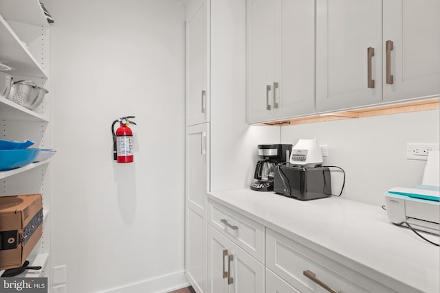 bar with white cabinetry