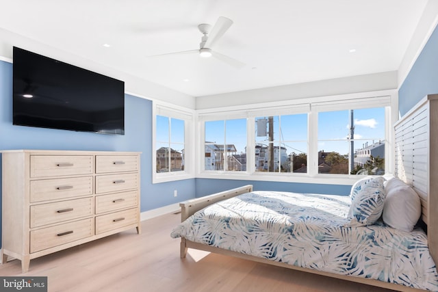 bedroom featuring ceiling fan and light wood-type flooring