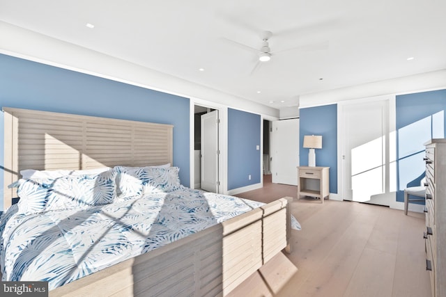 bedroom with hardwood / wood-style flooring and ceiling fan