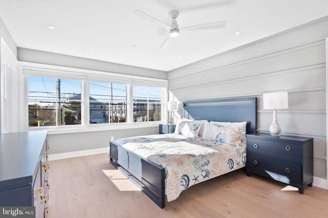 bedroom featuring ceiling fan and light hardwood / wood-style flooring