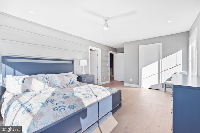 bedroom with ceiling fan and light wood-type flooring