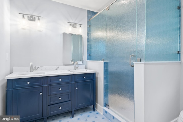 bathroom with vanity and walk in shower