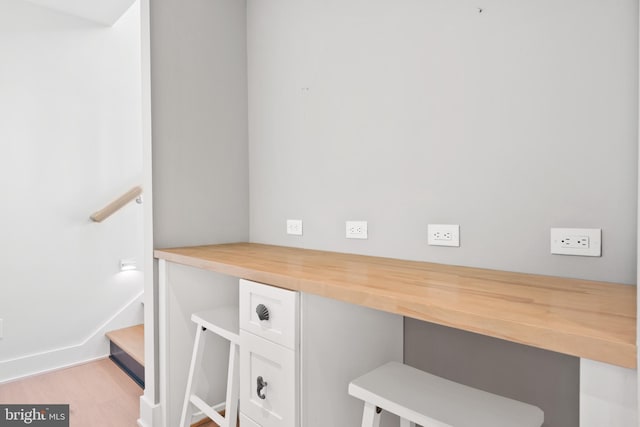 office featuring light wood-type flooring and built in desk